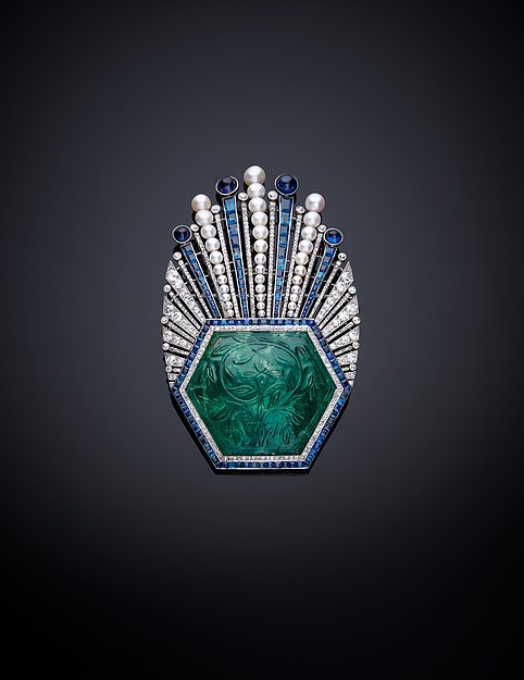 Paul Iribe (French, Angoulême 1883–1935 Roquebrune-Cap-Martin) Aigrette, 1910 Platinum, set with emerald, sapphires, diamonds, and pearls; H. 3 5/8 in. (9 cm) W. 2 1/4 in. (5.6 cm) D. 5/8 in. (1.5 cm) The Metropolitan Museum of Art, New York, The Al Thani Collection (MJ.133) http://www.metmuseum.org/Collections/search-the-collections/458931